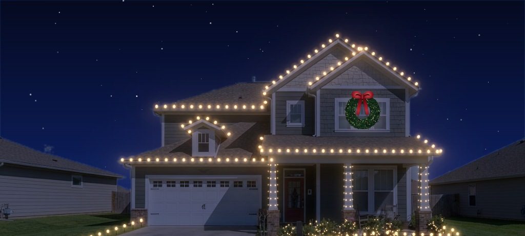 A two-story home with C9s, wrapped columns, a wreath and driveway stakes.