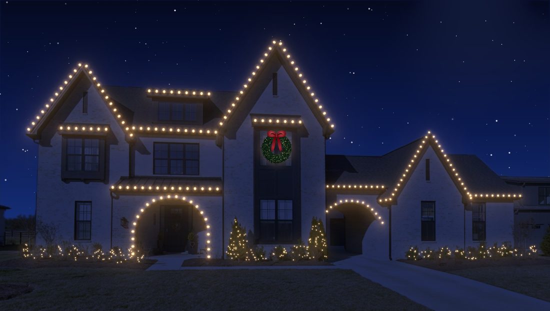 A modern farmhouse with warm white C9s on every gable.