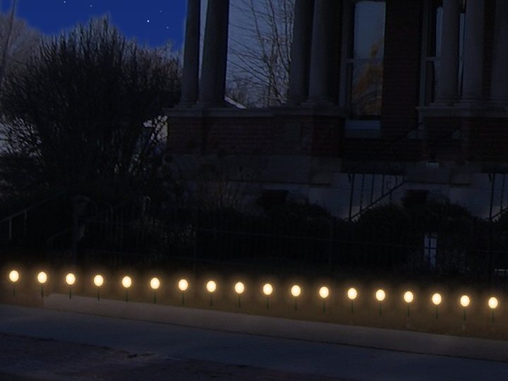 C9 lights on stakes along the sidewalk.